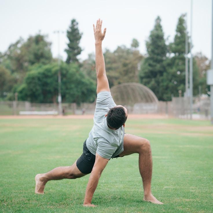 Women in a fitness class doing stretching and mobility exercises